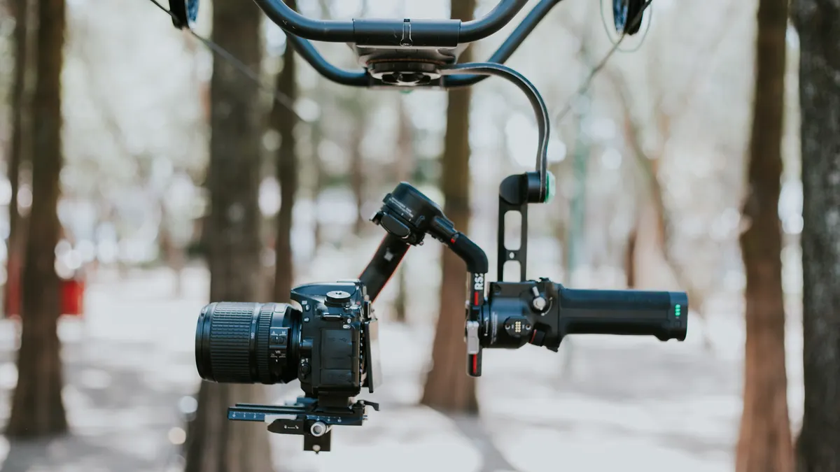 Camera mounted on a handheld gimbal outdoors