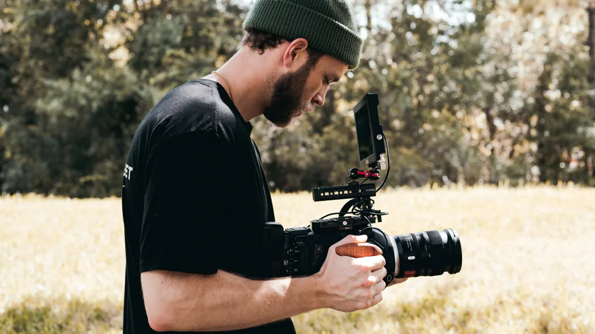 Man filming with a camera on a handheld gimbal