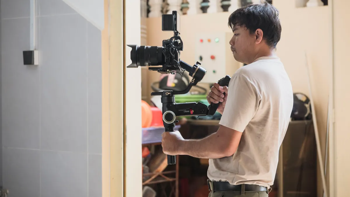 Man holding a camera on a gimbal
